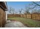 Fully fenced backyard with a patio area and plenty of green space for outdoor activities and privacy at 1957 N Colorado Ave, Indianapolis, IN 46218