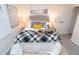 Charming bedroom featuring a comfortable queen bed and soft, inviting decor at 1957 N Colorado Ave, Indianapolis, IN 46218