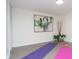 Bright bonus room with luxury vinyl plank flooring, natural light, and neutral walls, ideal for exercise at 1957 N Colorado Ave, Indianapolis, IN 46218