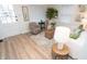 Inviting living room with wood flooring, neutral furniture, and tasteful decor at 1957 N Colorado Ave, Indianapolis, IN 46218