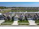 Community aerial view featuring homes with a pond, walking paths, and common green spaces at 19771 Sutton Ter, Westfield, IN 46074