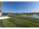 Beautifully landscaped backyard with a serene lake, perfect for relaxation and enjoying nature at 19771 Sutton Ter, Westfield, IN 46074