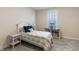 Cozy bedroom features a charming bed, a window with blind, and a bookshelf in a relaxing space at 19771 Sutton Ter, Westfield, IN 46074