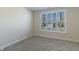 Clean bedroom features neutral carpet, a window with shutters, and fresh, neutral paint at 19771 Sutton Ter, Westfield, IN 46074
