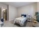Charming bedroom with a cozy bed, stylish decor, and an open doorway to an ensuite bathroom at 19771 Sutton Ter, Westfield, IN 46074