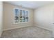 Bright bedroom featuring neutral carpet, a window with shutters, and fresh, neutral paint at 19771 Sutton Ter, Westfield, IN 46074