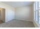 Light and airy bedroom with plush carpet, closet, and window with plantation shutters at 19771 Sutton Ter, Westfield, IN 46074