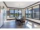Sunlit dining room with large windows that overlook a serene water feature at 19771 Sutton Ter, Westfield, IN 46074