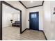 Entryway with wood floors and a view to a living room creating a warm welcome at 19771 Sutton Ter, Westfield, IN 46074