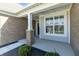 Charming front porch with brick accents, offering a cozy and inviting entry to the home at 19771 Sutton Ter, Westfield, IN 46074
