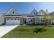 Charming single-Gathering home with a brick-accented facade, attached garage, and meticulously maintained lawn at 19771 Sutton Ter, Westfield, IN 46074