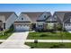 Aerial view showcasing a well-manicured front yard, brick and siding exterior, and a spacious driveway at 19771 Sutton Ter, Westfield, IN 46074