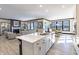 Spacious open-concept kitchen with a center island and views into the living and dining areas at 19771 Sutton Ter, Westfield, IN 46074