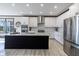Modern kitchen with a large island, stainless steel appliances, and white cabinetry at 19771 Sutton Ter, Westfield, IN 46074