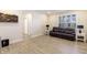 Bright, airy living room featuring light wood floors, comfortable sofa, and a large window at 19771 Sutton Ter, Westfield, IN 46074