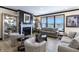 Inviting living room showcasing a fireplace and serene waterfront views at 19771 Sutton Ter, Westfield, IN 46074