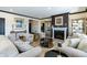 Elegant living room features a fireplace, display cabinets and stylish furniture at 19771 Sutton Ter, Westfield, IN 46074