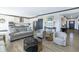 Open-concept living space with sleek floors and modern furnishings at 19771 Sutton Ter, Westfield, IN 46074