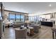 Open-concept living room and kitchen area with modern finishes and abundant natural light at 19771 Sutton Ter, Westfield, IN 46074