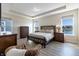 Cozy main bedroom with wood floors, neutral tones and water views at 19771 Sutton Ter, Westfield, IN 46074