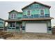 Two-story home under construction, featuring a two-car garage and a covered porch at 221 Ames Dr, Whiteland, IN 46184