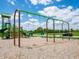 Community playground featuring swing sets and climbing structures for outdoor recreation, under a partly cloudy sky at 221 Ames Dr, Whiteland, IN 46184
