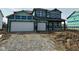 New two-story home features a two-car garage and covered porch, awaiting landscaping at 231 Ames Dr, Whiteland, IN 46184