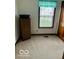 Cozy bedroom with neutral carpeting and a small window at 2359 S County Road 1050 E, Indianapolis, IN 46231