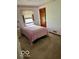 Cozy bedroom featuring natural light, neutral carpet and pink accents at 2359 S County Road 1050 E, Indianapolis, IN 46231