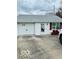 Inviting home exterior with a garage and well-maintained front yard, offering a clean and modern look at 2359 S County Road 1050 E, Indianapolis, IN 46231