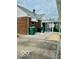 Brick house with a sunroom addition and paved driveway at 2359 S County Road 1050 E, Indianapolis, IN 46231