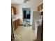 Compact kitchen with wooden cabinetry and essential appliances at 2359 S County Road 1050 E, Indianapolis, IN 46231
