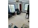 Living room with carpet, two large windows, and cozy recliners at 2359 S County Road 1050 E, Indianapolis, IN 46231