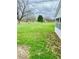 Expansive backyard with lush green grass and mature trees, offering plenty of space for outdoor activities at 2359 S County Road 1050 E, Indianapolis, IN 46231