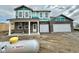New two-story brick home featuring an attached two-car garage and covered front porch at 240 Ames Dr, Whiteland, IN 46184