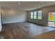 Open living room with hardwood floors, recessed lighting, and a sliding glass door at 240 Ames Dr, Whiteland, IN 46184