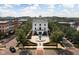 Aerial view of a building with a fountain and green space in front of it at 2618 Congress St, Carmel, IN 46032
