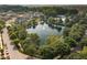 Aerial view of a water feature in a neighborhood with green trees at 2618 Congress St, Carmel, IN 46032