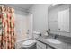 Well-lit bathroom featuring a shower-tub combo and granite countertop sink at 2618 Congress St, Carmel, IN 46032