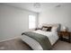 Cozy bedroom with a queen-sized bed, carpet, and natural light at 2618 Congress St, Carmel, IN 46032