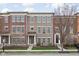 Charming brick townhome with manicured lawn and inviting entrance, creating great curb appeal at 2618 Congress St, Carmel, IN 46032