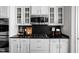 Well-appointed kitchen featuring white cabinetry, dark countertops, and stainless-steel appliances at 2618 Congress St, Carmel, IN 46032