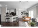 Inviting open-concept living and kitchen area with hardwood floors and stylish decor at 2618 Congress St, Carmel, IN 46032