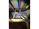 A view of the basement plumbing with new blue and red PEX piping and some exposed ductwork at 2627 Chase St, Anderson, IN 46016