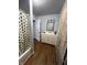 Bathroom with vanity, mirror, shower/tub combo, and flooring at 2627 Chase St, Anderson, IN 46016