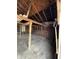 Garage interior with wooden support beams, concrete floor, and open doorway at 2627 Chase St, Anderson, IN 46016