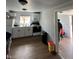Bright kitchen features white cabinets, modern appliances, and wood-look vinyl flooring at 2627 Chase St, Anderson, IN 46016