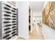 Hallway with wine storage on one side and a view of the dining room on the other at 3246 Fawn Cir, Brownsburg, IN 46112