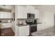 Kitchen with white cabinets, stainless steel appliances, granite countertops, and hardwood flooring at 3246 Fawn Cir, Brownsburg, IN 46112