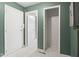 Basement features tiled floor, multiple doors, and olive green walls at 3407 Allison Ave, Indianapolis, IN 46224